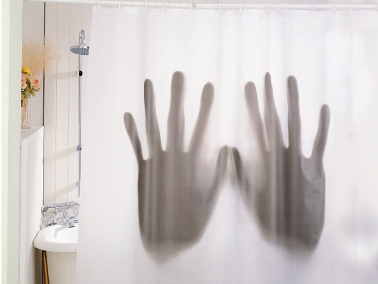 A novelty shower curtain decorated with the silhouette of a giant pair of h...